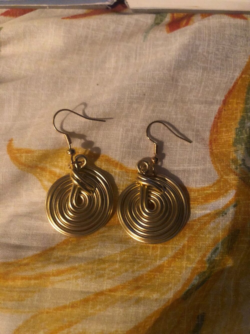 Gold spiral pierced earrings